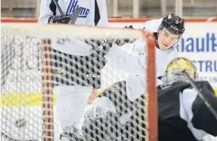  ?? JASON MALLOY • THE GUARDIAN ?? Charlottet­own Islanders defenceman Felix Tremblay rips a shot on goalie Jacob Goobie during a scrimmage at the end of Saturday’s practice at Eastlink Centre.