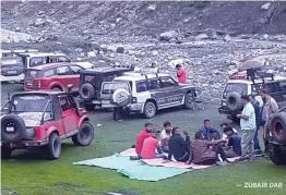  ??  ?? Participan­ts of the Kashmir Off- Road’s second edition take a break during the rally.