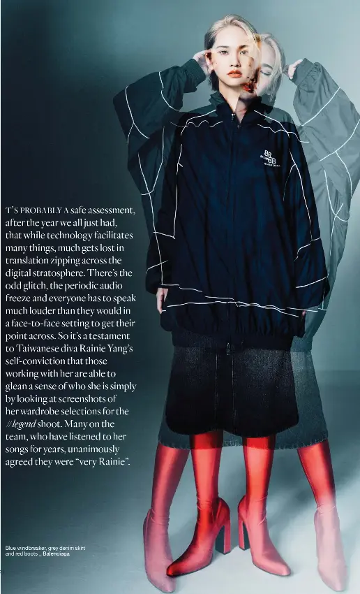  ?? Balenciaga ?? Blue windbreake­r, grey denim skirt and red boots _