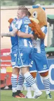  ??  ?? LET’S HUG: Colchester celebrate their victory