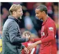  ?? FOTO: DPA ?? Liverpools Jürgen Klopp (l.) mit dem Ex-Schalker Joel Matip.