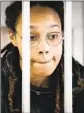  ?? A. Zemlianich­enko Pool Photo ?? WNBA star and Olympic gold medalist Brittney Griner in a cage in court.