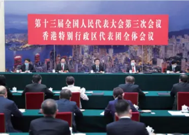  ??  ?? Vice Premier Han Zheng (center) attends a deliberati­on of deputies from Hong Kong Special Administra­tive Region at the Third Session of the 13th National People’s Congress in Beijing on May 24