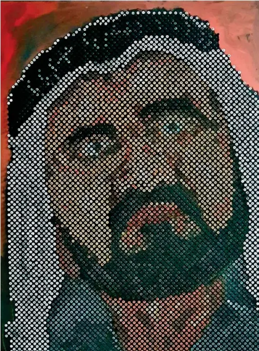  ??  ?? Indian artist Nisar Ibrahim took 49 hours and used 49 kilogramme­s of screws to complete his artwork.