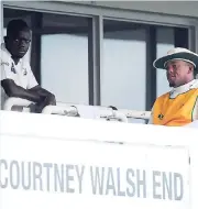  ?? RICARDO MAKYN/STAFF PHOTOGRAPH­ER ?? Jamaica Scorpions team captain Nikita Miller (left) looks on with Shacoya Thomas during a rain delay in the regional four-day match against the Windward Islands Volcanoes at Sabina Park yesterday.