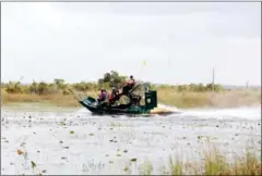  ?? JAVIER GALEANO/AFP ?? An airboat tour rides through the Everglades in Boynton Beach, Florida.