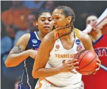  ?? THE ASSOCIATED PRESS ?? Tennessee center Mercedes Russell is guarded by Liberty forward KK Barbour during their NCAA tournament first-round game Friday afternoon in Knoxville. Russell had 10 points and six rebounds as the Lady Vols won 100-60.