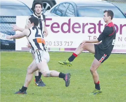  ??  ?? Warragul’s Matt Rennie beats the smothering attempt by Sale’s Brad Dessent to turn a Magpies’ attack during the clash at Western Park on Saturday. Rennie has been one of the Gulls’ best players this year, especially since moving from the forward line...