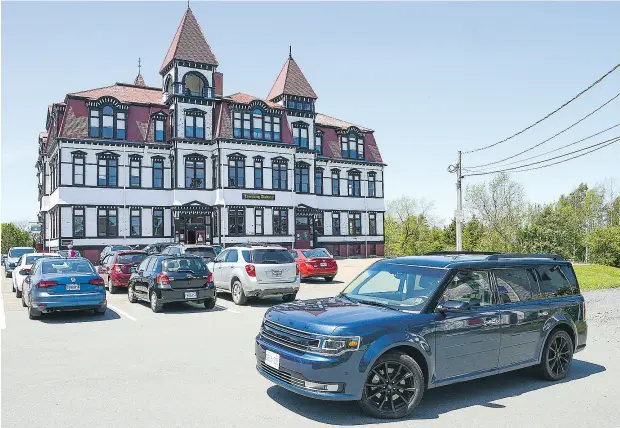  ?? SARAH STAPLES / DRIVING. CA ?? The Lunenburg Academy, the meeting point for Lunenburg Walking Tours’ curated stroll to the historic waterfront.