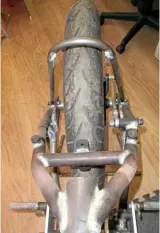  ??  ?? This is the rear frame, brake torque arm and mudguard bracket.