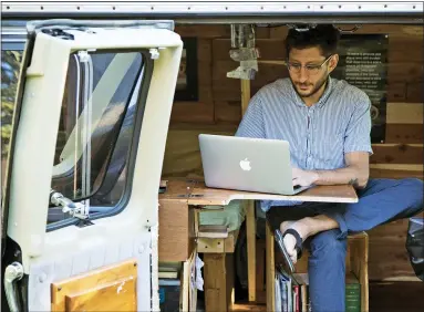  ?? FENSTER FAMILY PHOTO VIA AP, FILE ?? In this 2018, photo, Danny Fenster works out of his van that he made into a home/office in Detroit. U.S. journalist Fenster, imprisoned in Myanmar for almost four months while awaiting trial, appeared dishearten­ed during a court hearing Monday, his lawyer said.