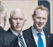  ?? Jim Lo Scalzo EPA/Shuttersto­ck ?? VICE PRESIDENT Mike Pence, center, with Patrick Shanahan, a deputy secretary of Defense. Air Force proposals for a new “space force” differ significan­tly from suggestion­s released last month by Shanahan.