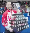  ?? CHRIS VAUGHAN, THE CANADIAN PRESS ?? Newfoundla­nd and Labrador skip Brad Gushue with his first Brier tankard on Sunday in St. John’s.