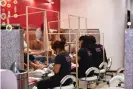  ?? ?? Nail technician­s undergo significan­t hours of training, courses and exams to obtain licenses to work in the industry. Photograph: Angela Weiss/AFP/Getty Images