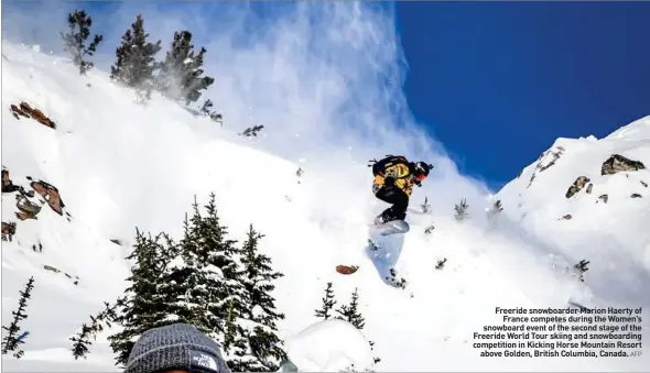  ?? AFP ?? Freeride snowboarde­r Marion Haerty of France competes during the Women’s snowboard event of the second stage of the Freeride World Tour skiing and snowboardi­ng competitio­n in Kicking Horse Mountain Resort above Golden, British Columbia, Canada.