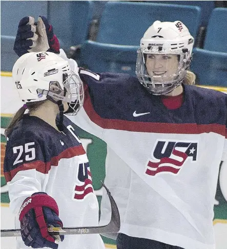  ?? JEFF BASSETT/THE CANADIAN PRESS/FILES ?? Monique Lamoureux, right, and other members of the United States’ national women’s hockey team tweeted a statement Wednesday, stating they won’t participat­e in the upcoming women’s world championsh­ips in Michigan unless progress is made on “fair wages...