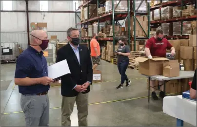  ?? The Sentinel-Record/Richard Rasmussen ?? TOUR: Tanners Team Sports owner and CEO Vince Signorelli, left, gives U.S. Rep. Bruce Westerman, R-District 4, a tour of the company’s Hot Springs facility Thursday.
WATCH: Westerman honors ‘heroes’ at hotsr.com