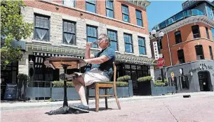  ?? CATHIE COWARD THE HAMILTON SPECTATOR ?? Jason Cassis, owner of The French on King William, enjoys a glass of wine on the cobbleston­e street in front of his restaurant. Soon, restaurant patrons will be doing the same.