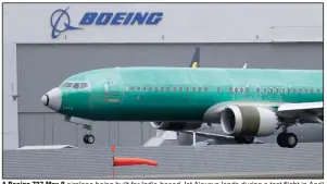  ?? (AP) ?? A Boeing 737 Max 8 airplane being built for India-based Jet Airways lands during a test flight in April at Boeing Field in Seattle. Boeing says it lost $2.40 billion in the second quarter.