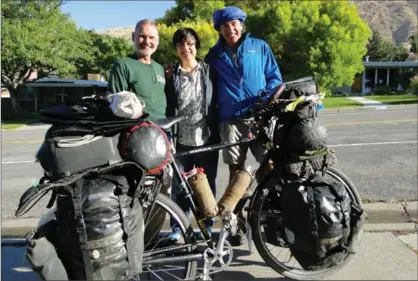  ?? LOUIS MELINI, NYT ?? Above: Louis Melini, once a Warm Showers board member, his wife Julie Melini and Alvaro Neil, a Spanish cyclist. Warm Showers pairs itinerant bicyclists with hosts who offer their homes at no charge.