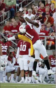  ?? TONY AVELAR — THE ASSOCIATED PRESS ?? Stanford cornerback Paulson Adebo (11) breaks up a pass intended for USC receiver Tyler Vaughns in the first half.