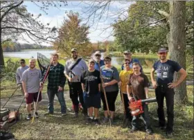  ?? SUBMITTED PHOTO ?? Volunteers joined Friends of Kaercher Creek, led by Tim Mazaika of Tilden Township, for a Make A Difference Day clean up event in October 2017 to cut grass, clear paths and clean up trash at Kaercher Creek in Hamburg. A spring clean up was also held...
