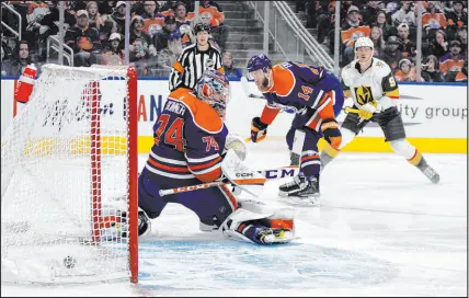  ?? ?? Knights center Jack Eichel scores on Oilers goalie Stuart Skinner as Mattias Ekholm defends just 1:01 into Saturday’s game. Eichel also assisted on Jonathan Marchessau­lt’s third-period goal.