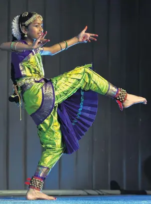  ?? PHOTO: PETER MCINTOSH ?? Cultural event . . . Young dancer Thanuja Luxmanan (11) performs at the first Dunedin Cultural Event for World Refugee Day yesterday.