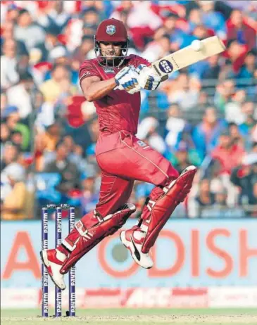  ??  ?? West Indies' Nicholas Pooran plays a shot during the third and final ODI against India at Barabati Stadium in Cuttack on Sunday.
ANI