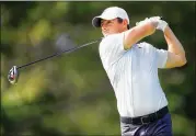  ?? SAM GREENWOOD / GETTY IMAGES ?? Rory McIlroy plays a shot during a practice round at the Sentry Tournament of Champions at Kapalua Golf Club Plantation course Tuesday.