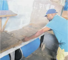  ?? ?? Clothes vendor Mollo at the Christiana Market shows the small space that he and his colleagues are suppose to utilise for selling.