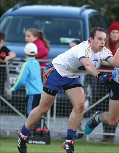  ??  ?? St Colmcille’s Jeff Kavanagh sprints away from Ratoath’s Eamon Wallace during Friday’s Senior Championsh­ip