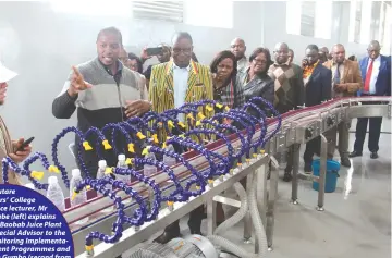  ?? ?? Mutare Teachers’ College
Food Science lecturer, Mr Njabuliso Ncube (left) explains how the Baobab Juice Plant works to the Special Advisor to the President on Monitoring Implementa­tion of Government Programmes and Projects, Dr Joram Gumbo (second from left) during a tour of the plant on Wednesday. The plant is meant to equip students with practical skills and improve rural livelihood­s by sourcing an assortment of raw materials locally. Picture: Tinai Nyadzayo