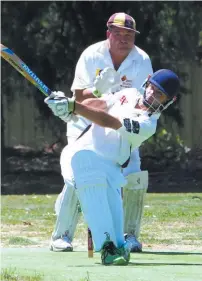  ??  ?? Warragul’s Ty Miller hits out during the division six match against Drouin.