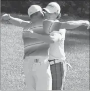  ?? Andrew Redington, Getty Images ?? Sergio Garcia, left, and Rory Mcilroy hug during their miserable round at the Masters on Saturday.