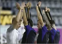  ?? ASHLEY LANDIS — THE ASSOCIATED PRESS ?? United States players participat­e in an official training session at AlGharafa SC Stadium, in Doha on Saturday.