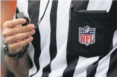  ?? DOUG PENSINGER, GETTY IMAGES ?? The NFL’s replacemen­t officials have been criticized for making a plethora of errors, but TV ratings aren’t suffering.