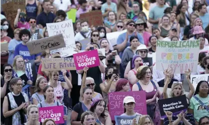  ?? Photograph: Paul Sancya/AP ?? Abortion rights protesters attend a rally outside the state capitol in Lansing, Michigan, in June, following the US supreme court's decision to overturn Roe v Wade.