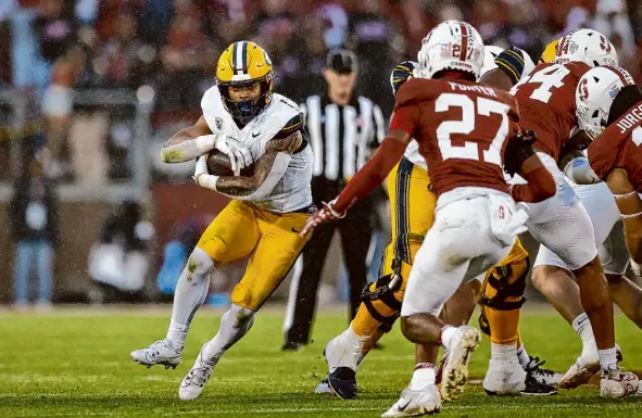  ?? Stephen Lam/The Chronicle ?? Cal running back Jaydn Ott rushed for 1,305 yards and 12 touchdowns this year. But he saved one of his best performanc­es for the biggest game of the regular season, a 166-yard effort to beat the Cardinal in the Big Game on Nov. 18 at Stanford.