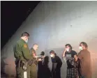  ?? JACK GRUBER/USA TODAY ?? Border Patrol agents detain three men suspected of illegally crossing into the U.S. near Granjeno, Texas, on July 13.
