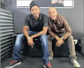  ??  ?? INKING A DEAL: Magesh and Guffy at a tattoo shop in Rosebank. In celebratio­n of his new track, Doing It In Style, Guffy has the name of his sixyear-old son, Phatshwane jr, tattooed on his arm.