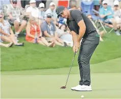  ??  ?? Jason Day of Australia attempts a putt on the 15th green during the third round of the Wells Fargo Championsh­ip at Quail Hollow Club on in Charlotte, North Carolina. — AFP photo