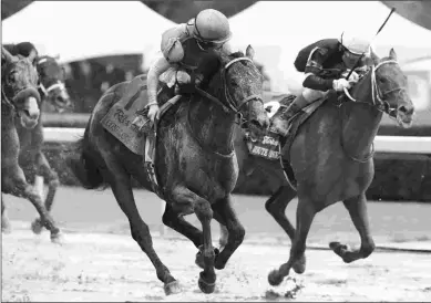 ?? COADY PHOTOGRAPH­Y ?? Confidence Game (left) wins the Grade 2 Rebel Stakes at Oaklawn Park over Red Route One.