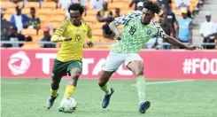  ?? | BackpagePi­x ?? Percy Tau of South Africa challenged by Alex Iwobi of Nigeria during their clash at FNB Stadium on Saturday. The match ended 1-1.