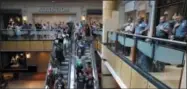  ??  ?? Protesters march through West County Mall in response to a not guilty verdict in the trial of former St. Louis police officer Jason Stockley as police officers stand by Saturday, Sept. 16, 2017, in Des Peres, Mo. Stockley was acquitted on Friday, in...