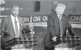  ?? AP ?? Ben Carson, left, and Donald Trump spar during a Republican presidenti­al debate last month.