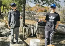  ?? COURTESY NEW MEXICO DEPARTMENT OF GAME & FISH ?? Preston and Parker Lawson, ages 10 and 11, of Albuquerqu­e caught six rainbow trout and one largemouth bass Nov. 14 at Tingley Beach.