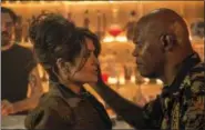  ?? JACK ENGLISH/LIONSGATE VIA AP ?? This image released by Lionsgate shows Salma Hayek, left, and Samuel L. Jackson in “The Hitman’s Bodyguard.”