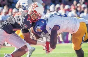  ?? ROBERTO E. ROSALES/JOURNA ?? UNM safety Daniel Henry, left, hits San Jose State’s Deontae Cooper last season. Henry was a team captain for the Lobos as a senior and was an All-Mountain West Conference honorable mention player.