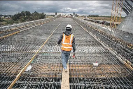  ?? Robert Gauthier Los Angeles Times ?? CONSTRUCTI­ON ON the San Joaquin River viaduct section of the high-speed rail line in Fresno. Rail authority chief Brian Kelly says “there are going to be a lot of changes” as he begins to overhaul management of a project beset by scheduling, budget and other setbacks.